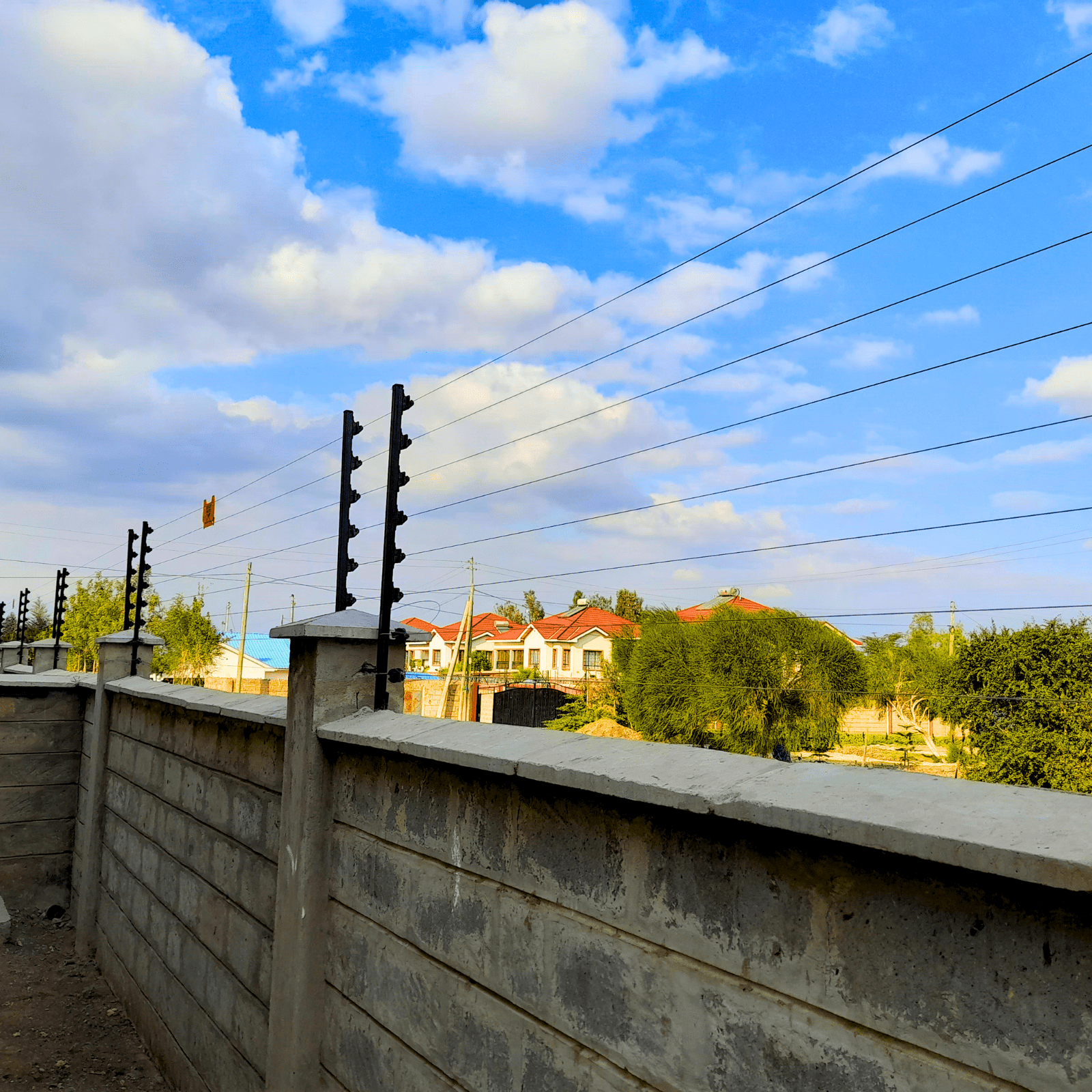 Electric fence installed with warning sign and proper earthing in Kenya